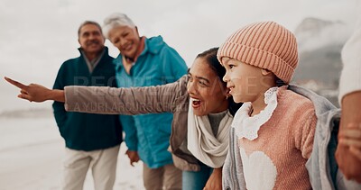 Buy stock photo Family, child and beach with pointing, happy and grandparent together on vacation by sea with view. Love, smile and young girl with mother outdoor in winter on holiday with retirement and travel