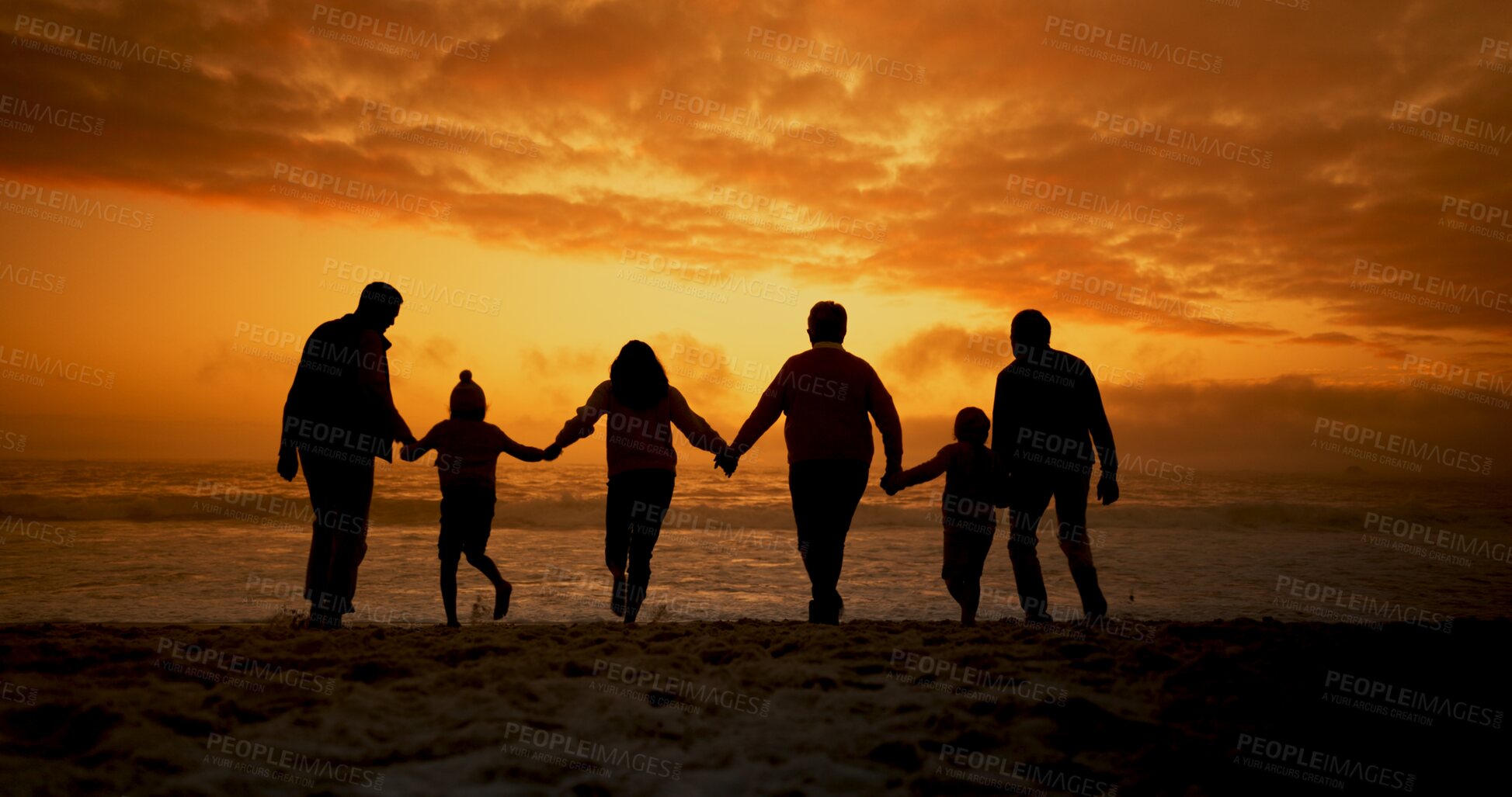 Buy stock photo Sunset, silhouette and family holding hands with back, kids and love by the beach with support on holiday. Vacation, shadow and ocean with parents, love and care together of parent and youth by sea