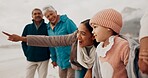 Family, child and beach with support, pointing and together on vacation by the sea with view. Love, smile and happy girl with grandparent and mother in winter on holiday with retirement and travel