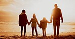 Holding hands, sunset and back of family by beach on vacation, getaway or holiday for bonding. Evening, love and parents with children for connection by ocean for tropical weekend trip in Mexico.