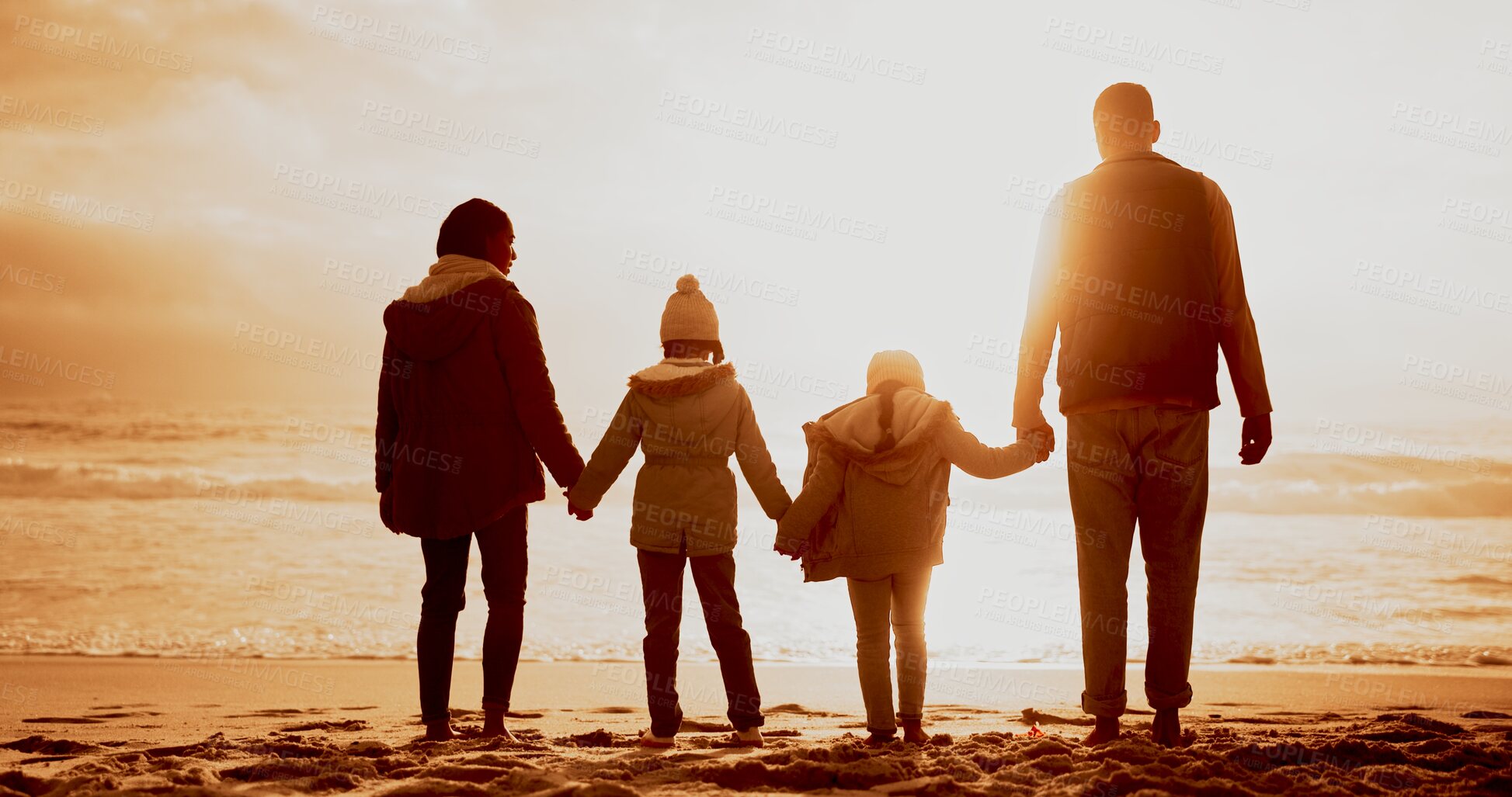 Buy stock photo Holding hands, sunset and back of family by beach on vacation, getaway or holiday for bonding. Evening, love and parents with children for connection by ocean for tropical weekend trip in Mexico.