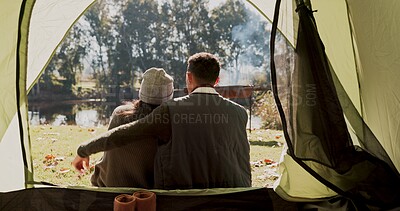 Buy stock photo Camping, tent and back of couple on vacation, adventure and journey in nature. People, hug and support at campsite for warmth, comfort and commitment in relationship in countryside for holiday