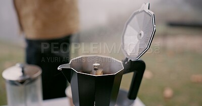 Buy stock photo Moka pot, espresso and cup outdoor in winter storm by person for hiking, travel and cozy relax with peace. Hot beverage, coffee and calm in nature for adventure and drink as latte from french press