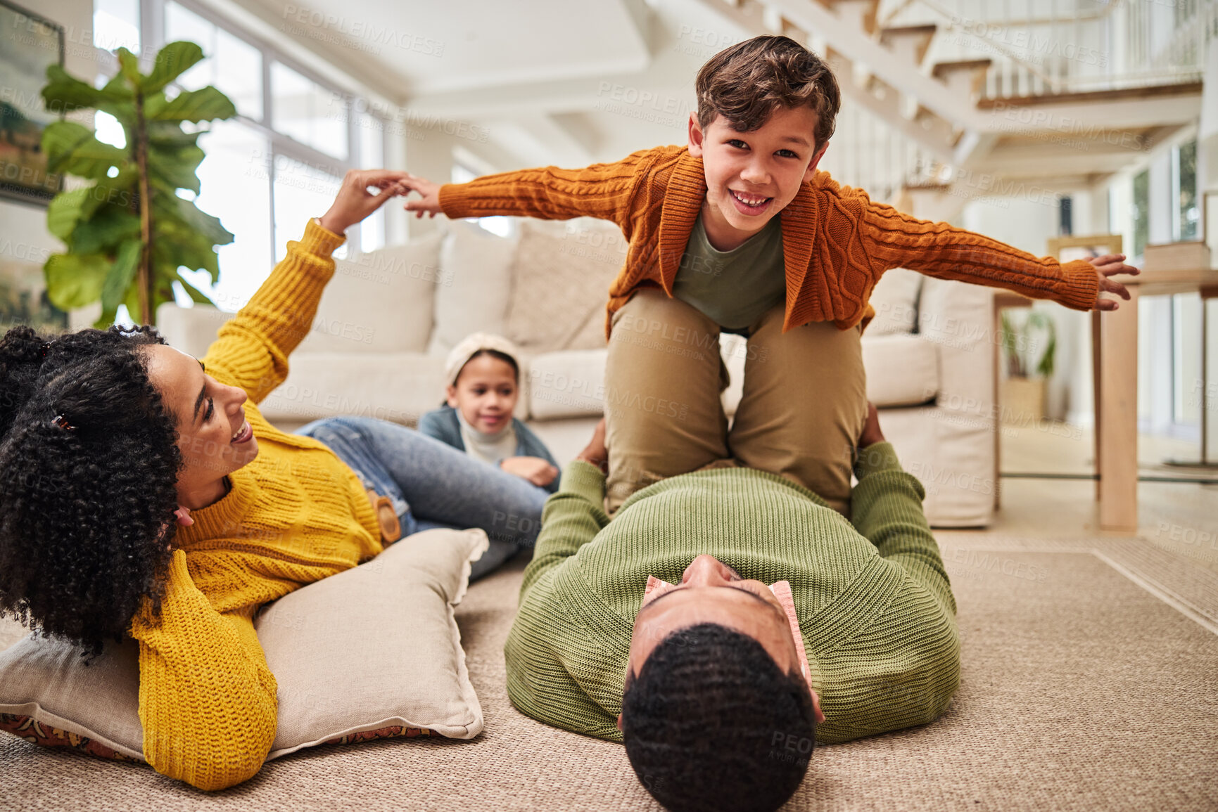 Buy stock photo Family, man and lift child for airplane, playful and portrait of boy in living room. Parents, kids and fantasy game in home for bonding, love and trust in relationship with balance, fun and support