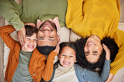 Buy stock photo Top view, family and children in home with portrait, winter fashion or support with smile or foster care. Adoption, face or happy kids with love, jersey and warm clothes to relax on floor in Canada