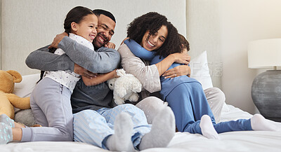 Buy stock photo Family, hug and support in home on bed with smile for wellness, relationship and trust in morning. Parents, solidarity and children in bedroom for happy, bonding and relax together as care on weekend