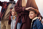 Hands, family and children with winter fashion, support and outdoor bonding with smile, joy or parents. Travel, happy kids and hug outside for love, care and warm clothes for cold climate in Canada