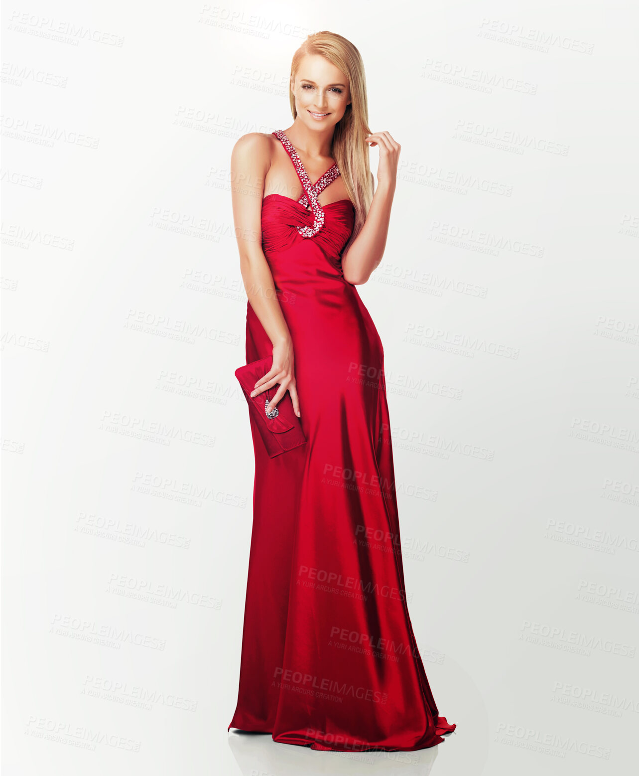 Buy stock photo Full length portrait of an elegant young woman in a beautiful red evening dress on white - Copyspace