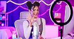 Video, streamer and girl with phone live streaming in neon bedroom for social media audience, fans or followers. Excited content creator, influencer or young woman waves hello with ring light at home