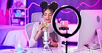 ASMR, neon and influencer woman with microphone, ring light and audio content creator in home studio. Streamer, girl and recording video for sound therapy platform, live stream or online broadcast