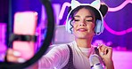 Selfie, girl or content creator with phone for live streaming update of gaming, review or sponsorship in neon bedroom. Gen z gamer or streamer with trendy headphones, ring light and phone for gaming