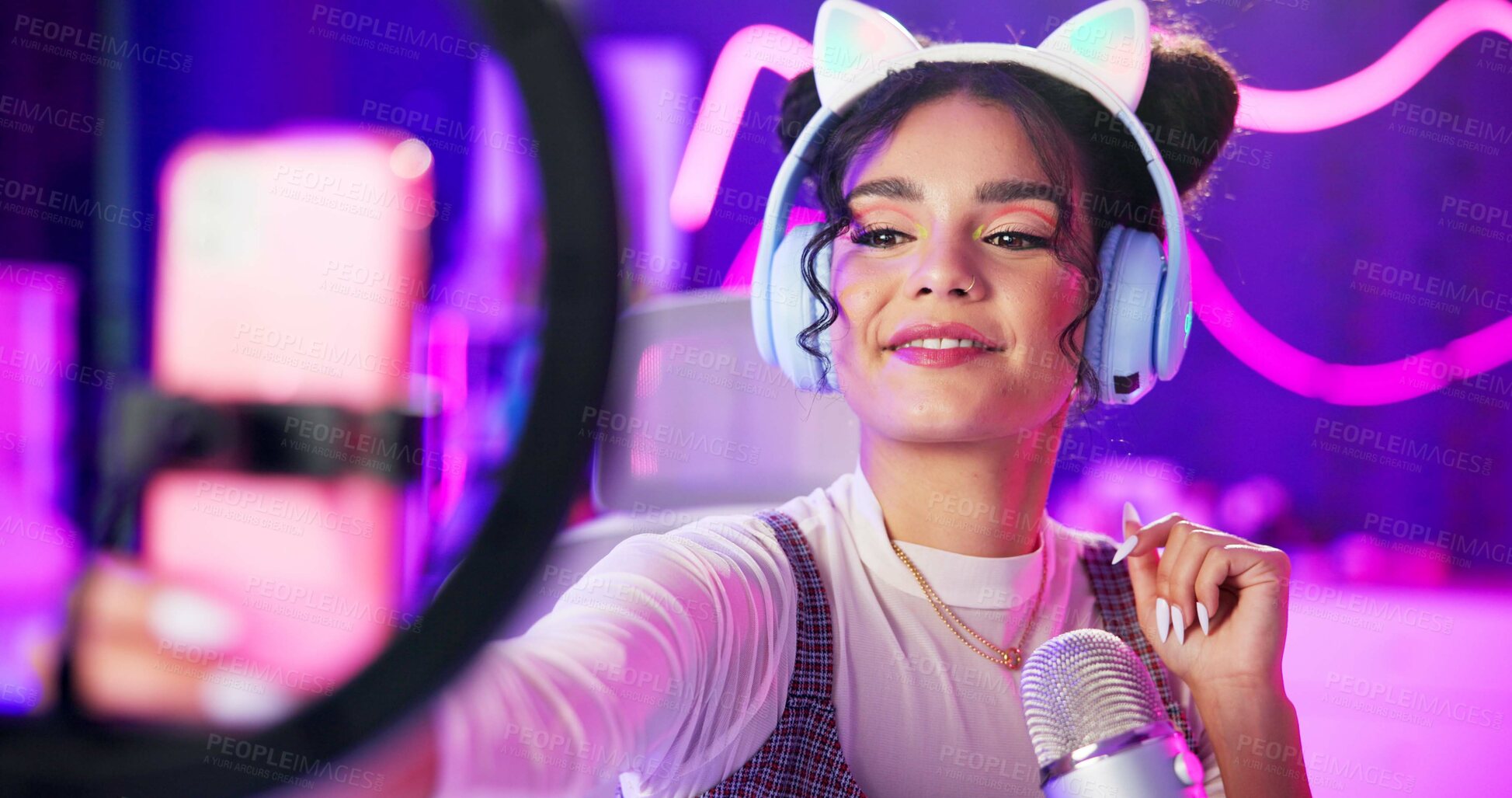 Buy stock photo Selfie, girl or content creator with phone for live streaming update of gaming, review or sponsorship in neon bedroom. Gen z gamer or streamer with trendy headphones, ring light and phone for gaming