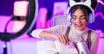 Woman, microphone and influencer with social media pen writing and ASMR for podcast. Home studio, creative and content creator with neon lights, online platform and streamer with audio and voice work