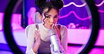 Woman, microphone and influencer with social media streaming and ASMR for podcast. Home studio, creative and content creator with neon lights, online platform and streamer with audio and voice work