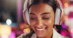 Woman, headphones and smile in night at office with music, streaming ir choice with song for inspiration. Person, employee and overtime in dark workplace with sound, audio or happy at creative agency