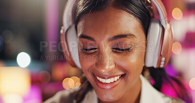 Buy stock photo Woman, headphones and smile in night at office with music, streaming ir choice with song for inspiration. Person, employee and overtime in dark workplace with sound, audio or happy at creative agency