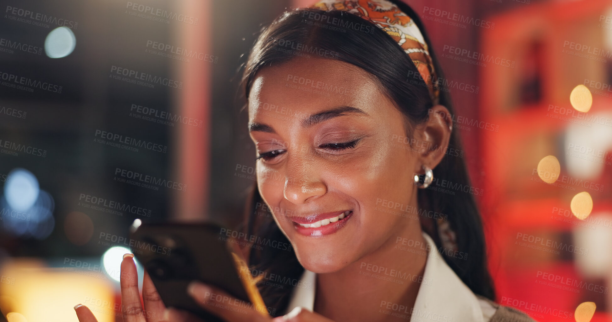 Buy stock photo Phone, smile and girl checking message, social media post or email notification in home at night. Scroll, smartphone and happy woman in apartment with mobile app for online dating, chat or connection