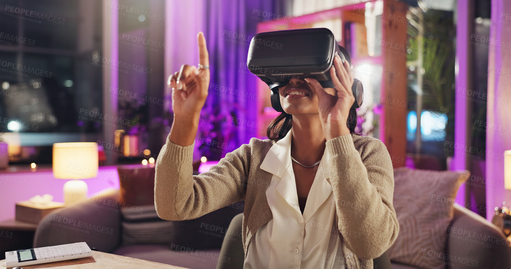 Buy stock photo Virtual reality, finger and woman in home at night for online games, entertainment and metaverse. Technology, apartment and happy person with vr goggles for AI experience, cyber network and streaming