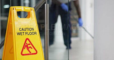 Buy stock photo Caution, sign and cleaning for floor, janitor and hygiene service and dark at night in office. Mop, job and disinfection with equipment with warning and male person, disinfectant and wet ground