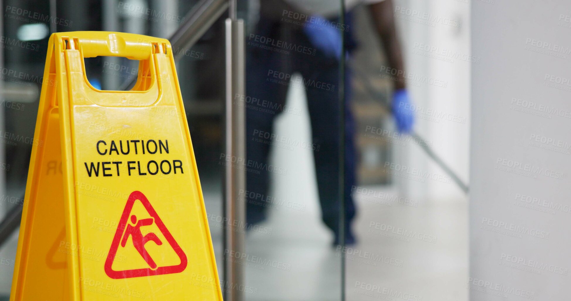 Buy stock photo Caution, sign and cleaning for floor, janitor and hygiene service and dark at night in office. Mop, job and disinfection with equipment with warning and male person, disinfectant and wet ground