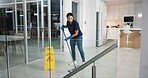 Woman, cleaner and mopping floor in office for fumigation, disinfect and safety suit from disease risk in building. Maintenance, female person and chemical liquid of pest control, health and hygiene 