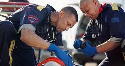 Buy stock photo Paramedic, emergency and men with accident in road for first aid, resuscitation and rescue service. Medical crisis, healthcare and EMS responder with saving for car crash,  help or patient assessment