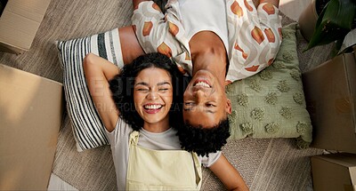 Buy stock photo Couple, above and happy on new home floor, happiness and love for relationship or moving with boxes. Relax, property investment and together in apartment living room, care and homeowners smile