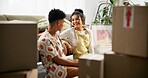 Happy couple, boxes and moving house with apartment, new home and milestone in bonding together. Woman, man and excited in lounge with marriage, support and progress for pride, love and relationship