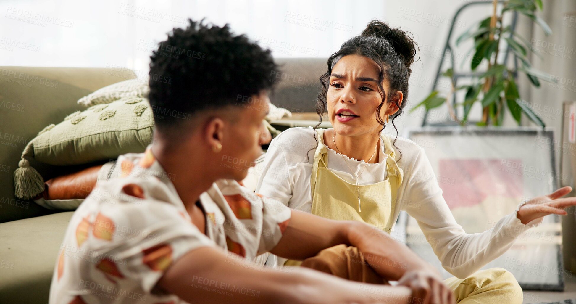 Buy stock photo Couple, fight and unhappy in toxic relationship, upset and conversation with disagreement, problem and home. Woman, man and talk in lounge for marriage, angry or annoyed in conflict, mistake or loss