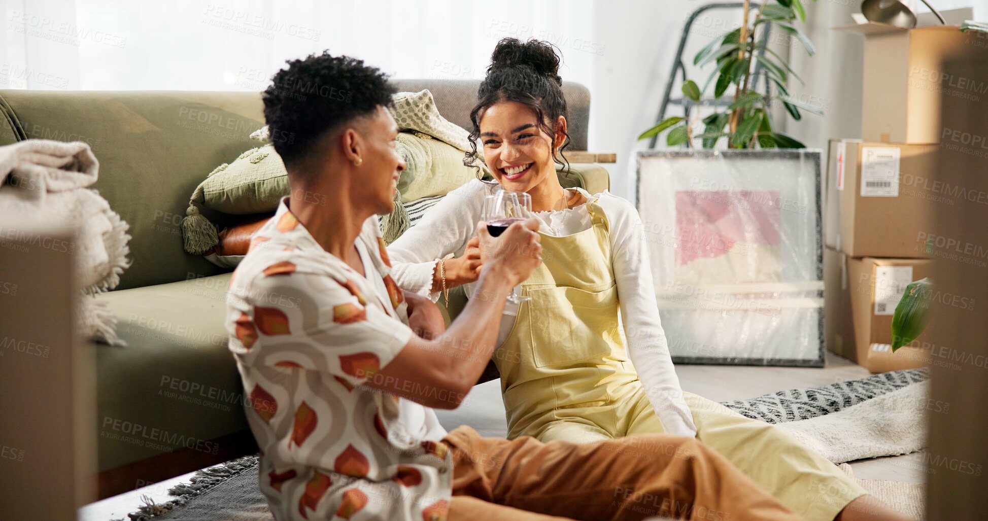 Buy stock photo Happy couple, wine and moving house with toast, new home and milestone for bonding together. Woman, man and boxes with excited, success and relationship for support, progress and pride in celebration