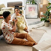 Happy couple, wine and boxes with toast, new home and milestone for ...