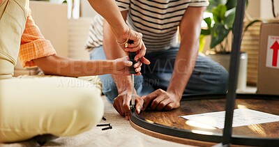 Buy stock photo Hands, screwdriver and table with couple in living room of home for DIY, renovation or repairs. Building, moving in and tool with people on floor of apartment for construction of furniture together