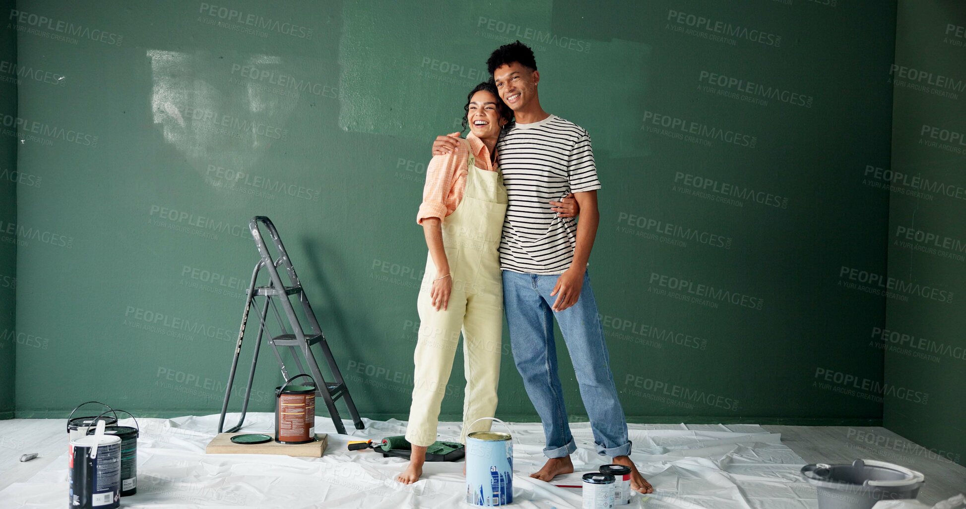 Buy stock photo Couple, people and smile with painting wall for house renovations, upgrade and bonding. New home, relationship and happy for makeover for fun with support, care and teamwork for love with diy