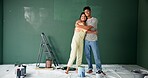 Couple, people and hug with painting wall for house renovations, upgrade and bonding. Home, relationship and happy or smile for fun with support, care and teamwork for love with diy for makeover