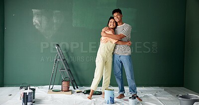 Buy stock photo Couple, people and hug with painting wall for house renovations, upgrade and bonding. Home, relationship and happy or smile for fun with support, care and teamwork for love with diy for makeover