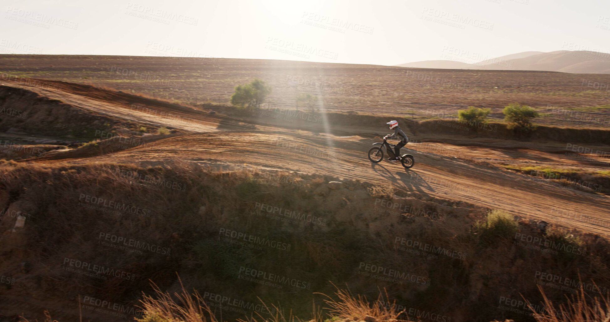 Buy stock photo Driving, person and motorbike in desert of sports for cross country training, performance technique and fitness journey. Athlete, driver and bicycle for travel adventure, dirt cycling and race rally