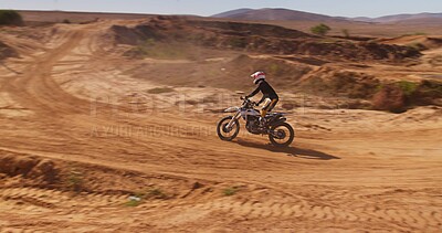 Buy stock photo Driving, driver and motorbike in desert of sports for speed training, performance technique and fitness journey. Athlete, person and bicycle power for travel adventure, dirt cycling and race rally