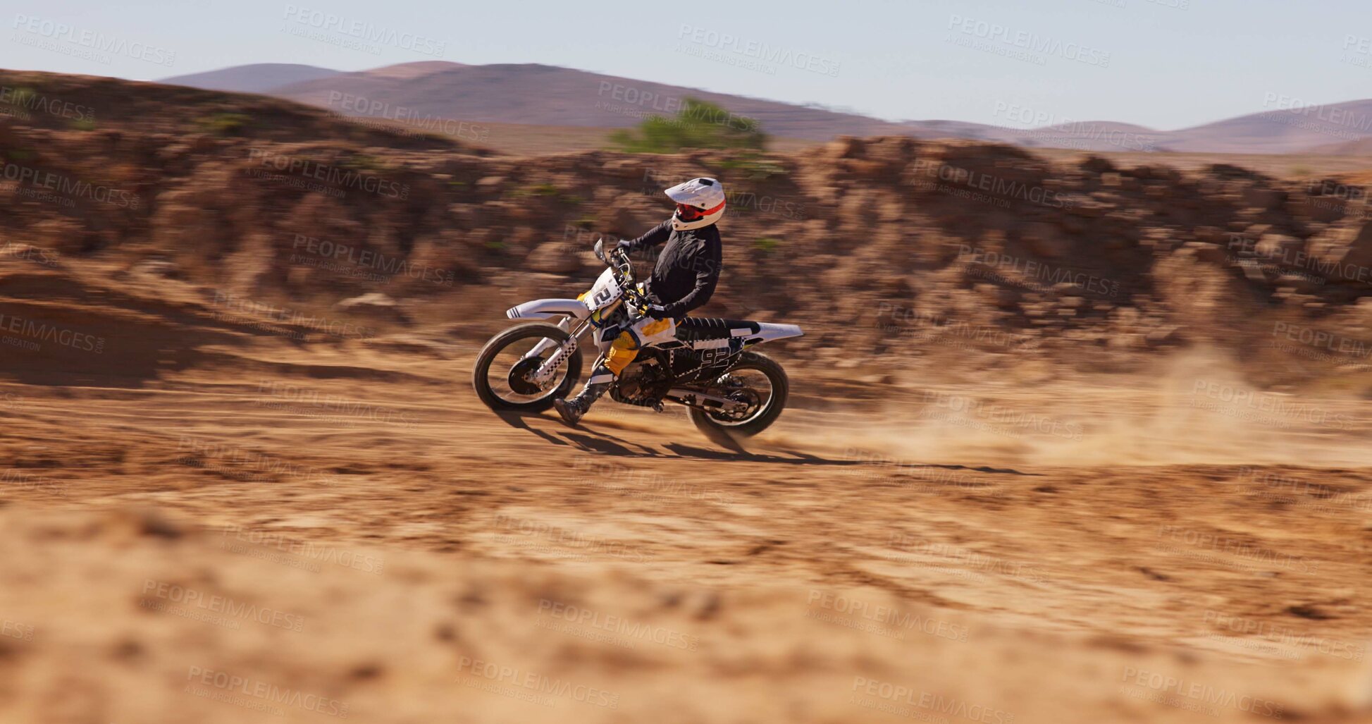 Buy stock photo Person, driving and desert with motorbike for sport of speed training, performance technique and fitness journey. Athlete, driver and bicycle power for travel adventure, dirt cycling and race rally