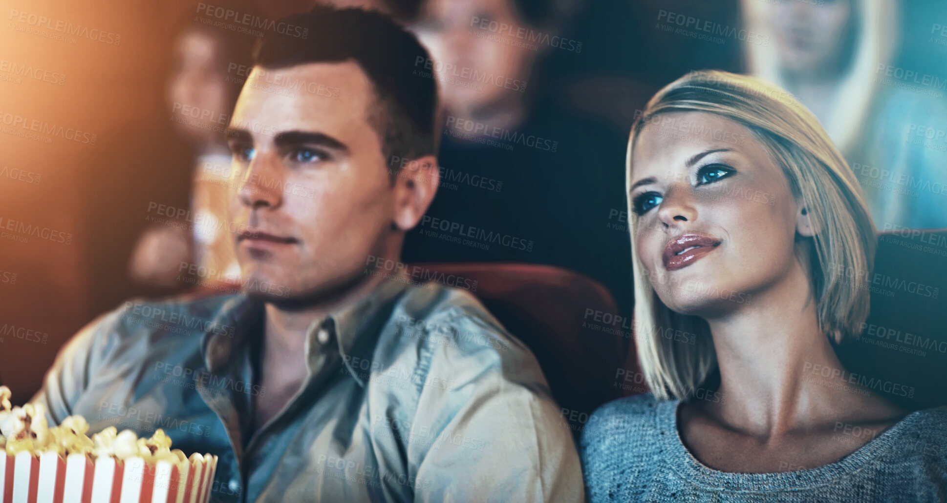 Buy stock photo Date, popcorn and couple at theater for watching movie, eating or romantic night together. Lens flare, evening and young woman with man in cinema with snack for entertainment, show or film premier