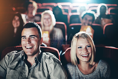 Buy stock photo Couple, cinema and laughing at funny movie in crowd on date night, relax and together for bonding. People, man and woman in theater for film, comedy and happy in audience with show in New Zealand