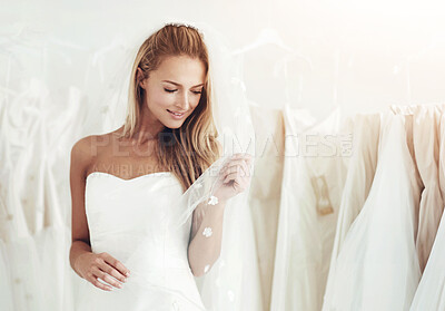 Buy stock photo A young bride trying on her wedding dress - Copyspace