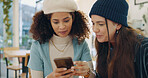 Girl, friends and phone in coffee shop for search, happy meeting on online connection for bonding at lunch. Smile, smartphone and women in cafe with mobile app, chat or social media gossip together