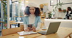 Woman, phone and reading in coffee shop with laptop, smile and remote work with notification for freelance job. African person, smartphone and thinking with contact, typing or networking in cafeteria