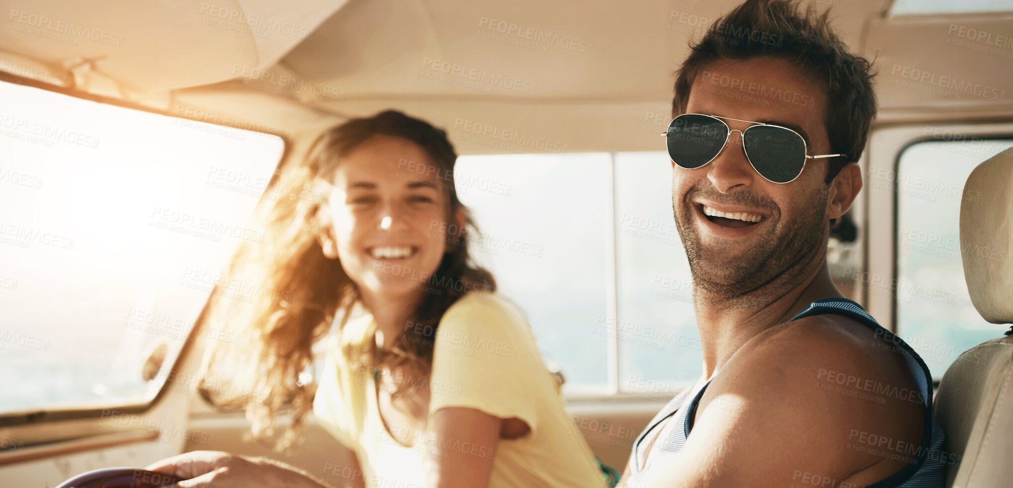 Buy stock photo Handsome male wearing glasses smiling and laughing with his girlfriend in the background