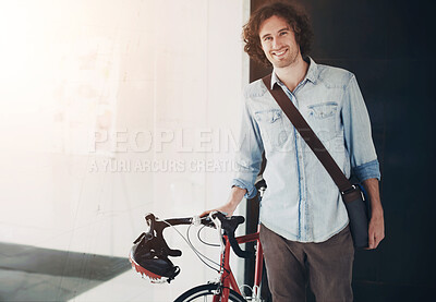 Buy stock photo Portrait, bicycle and business man in office for creative startup, happy career and internship opportunity. Young person, designer or employee with bike, carbon footprint and startup job in workplace