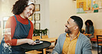 Hospitality, customer and waitress in cafe with cake, client order and smile at table. Barista woman, man and service in restaurant for sweet treat, small business and local support in coffee shop