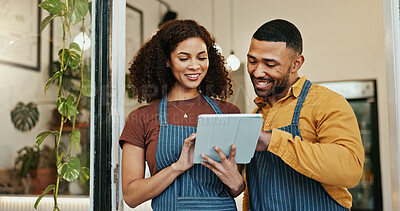 Buy stock photo Happy waiters, reading and browsing with tablet at cafe for online service, order or teamwork. Business people or barista with smile on technology for app, communication or startup at coffee shop