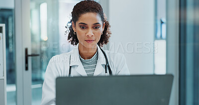 Buy stock photo Happy woman, doctor and typing with laptop for medical study, news or telehealth at hospital. Female person or healthcare employee on computer for online medicine, research or communication at clinic