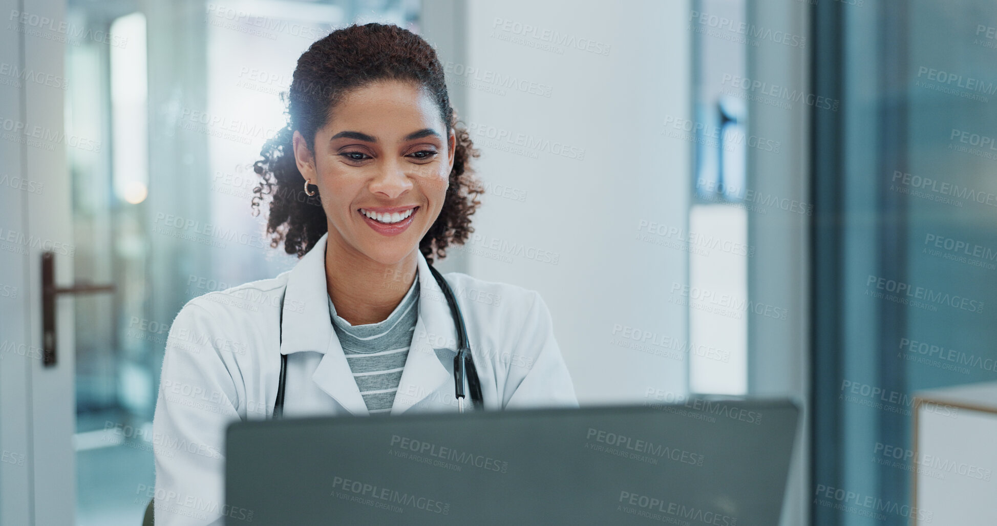 Buy stock photo Happy woman, doctor and typing with laptop for healthcare, good news or telehealth at hospital. Female person or medical employee with smile on computer for online research or communication at clinic