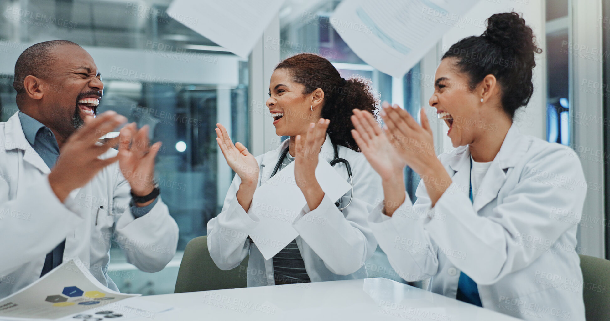 Buy stock photo Happy people, doctor and team with applause in celebration for done, success or finished at hospital. Group of excited medical employees clapping with documents in air for winning together at clinic